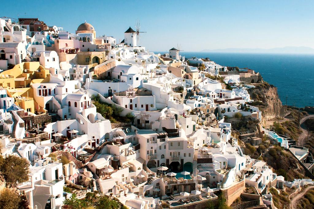 White buildings with blue domes in Santorini, Greece